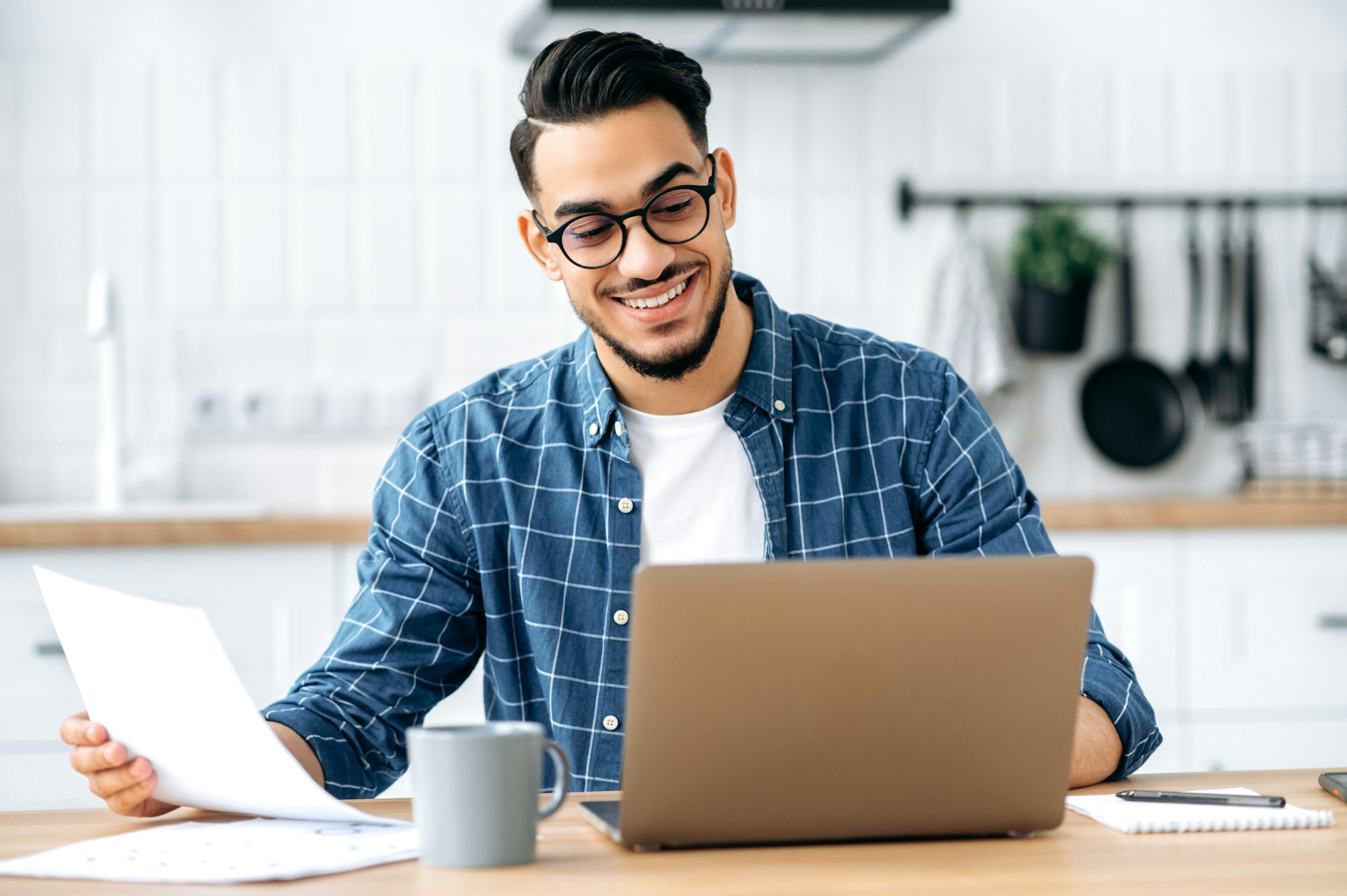 Work from home. Smart arabian or indian stylish man, freelancer, programmer, manager, working